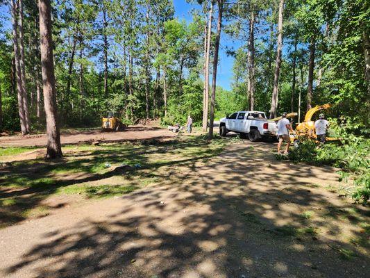 Land clearing and volleyball court installation summer of 2023