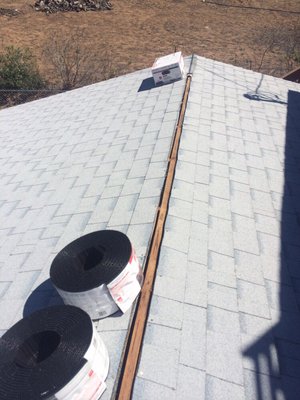 Owens Corning dimensional composition shingles with Owens Corning Vent Sure ridge vent.