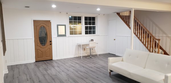 The entrance of the basement apartment after the laminate flooring was installed.