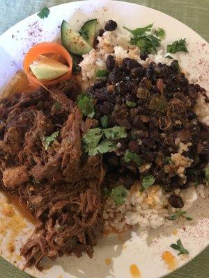 Delicious!  Ropa Vieja with black beans and rice.