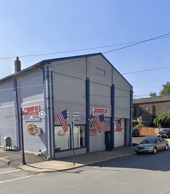 Store front view of Tom's Automotive in Port Jervis, NY