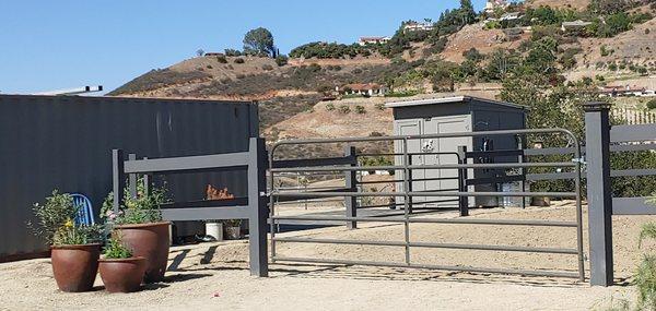 Hay storage painted to match fencing fits right in