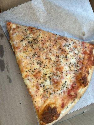 Cheese slice with pepper and oregano added