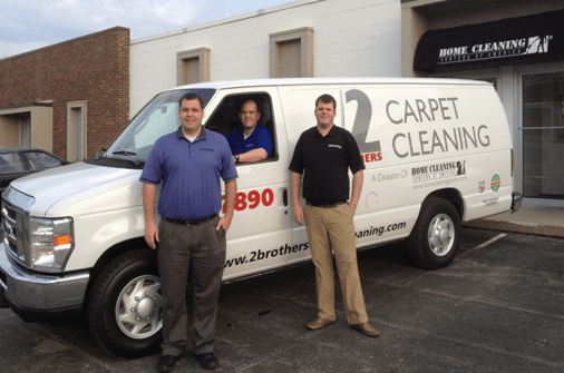 Brothers Ken and Dean Leffel standing in front of the carpet cleaning van