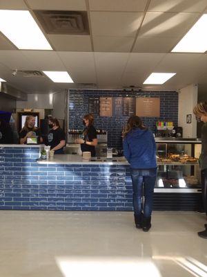 Pretty  blue tile at their counter for service.  Get your coffee, soda, or bakery.