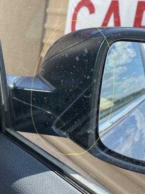 Water spots left to air dry on side window and side mirrors.