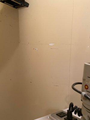 more holes in sheet rock in exam room