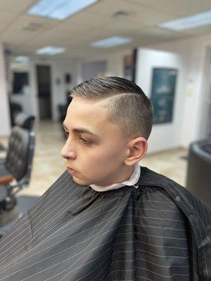 Fade with hard part and comb over