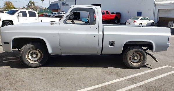 Chevy truck after blasting and primer coating applied.