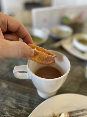 Churros dipped in hot chocolate