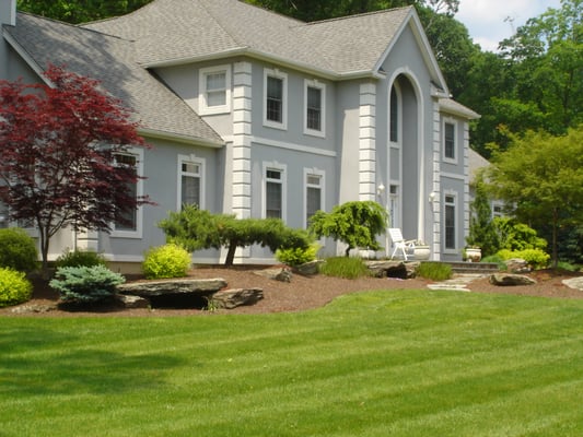 This front yard landscaping and garden design is in Montebello,NY.