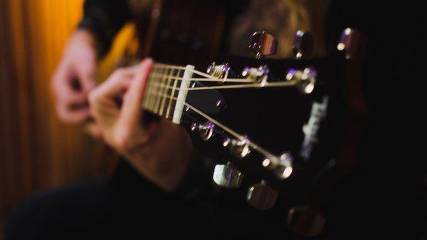 Tupelo Conjure laying down some acoustic guitar in the live room.