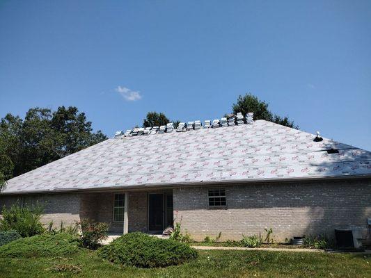 Re-roofing under way out at Kirkwood. When the roof is this dominant, shingle selection is very important.