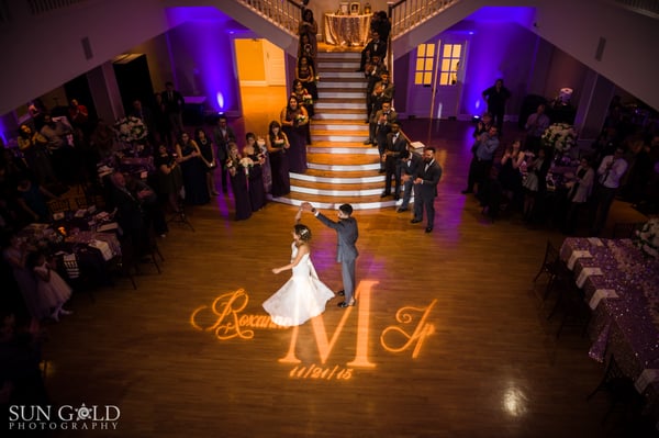 Bride and groom dancing.