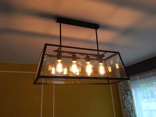 The dining room chandelier, Don made a base board to cover the hole in order to fit the skinny base