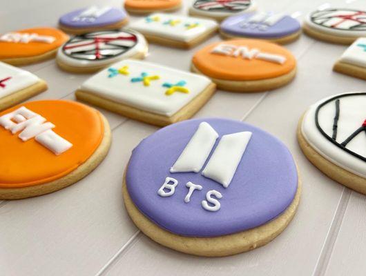 Customized BTS themed royal icing cookies.