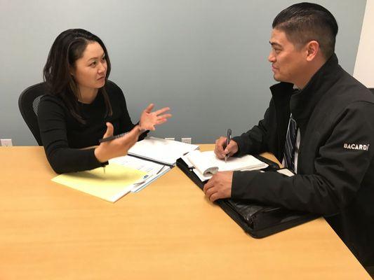 Attorney Susan Yu helping a client