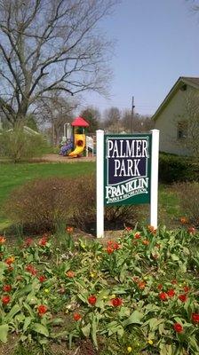 Perennials by the park sign