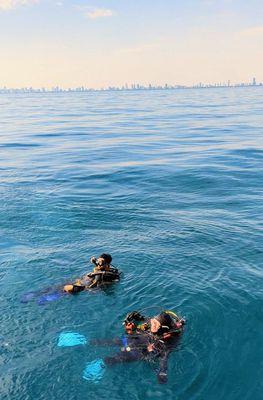 Ashwin and diving buddy Lynn Carpenter with blue fins