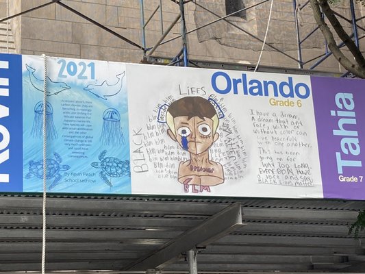 The Church has a school. They showcased the children's art on the scaffolding. 08/16/21