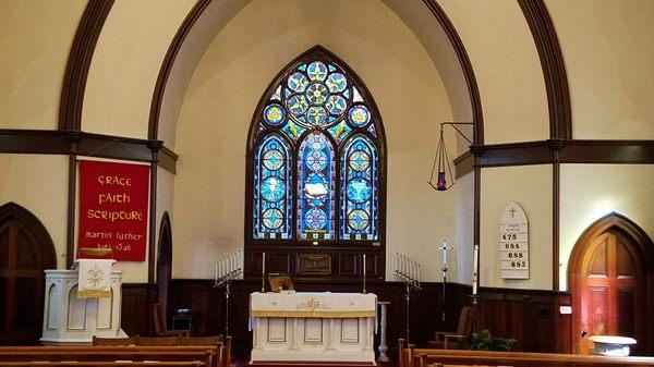 View of the altar and altar window of the sanctuary.