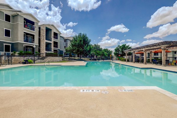 Large swimming pool with covered tables