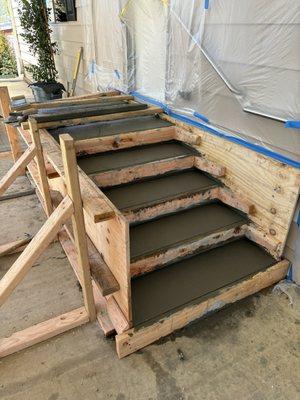 Framing and cement work creating a new landing and steps for access to our laundry room