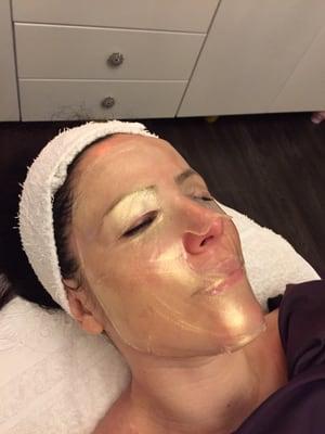 A relaxing gold facial before New Year's Eve.