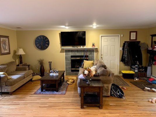 Looking Left, door to the garage threw off the whole space as we couldn't center the furniture on the fireplace