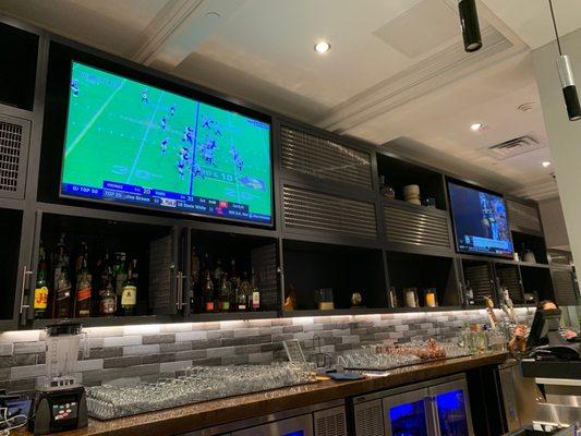 View of Bar with flat screen TVs showing sports