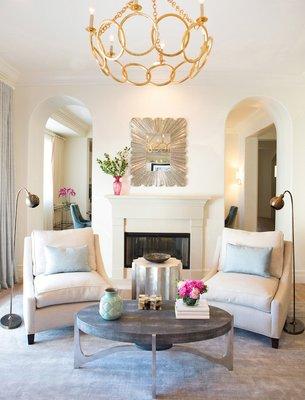 White on white, gorgeous living room w/ gold  chandelier. Invite your friends over.  Contact us to make it happen! http://www.loridennis.com