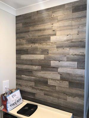 Old barn siding on the entrance wall for accent