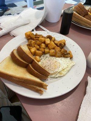 Eggs over medium ,home fries and toast