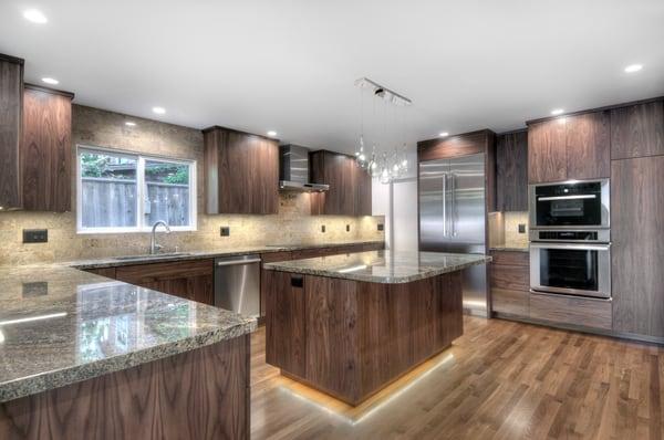 Menlo Park residential remodel, which is custom from the under cabinet lighting to the walnut cabinets, beautiful tear drop pendants