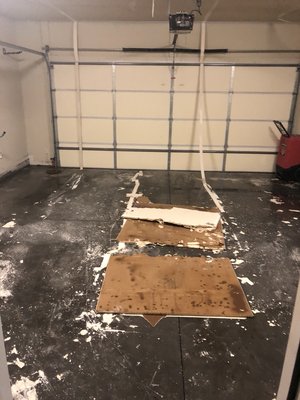 Garage ceiling that fell from water damage.