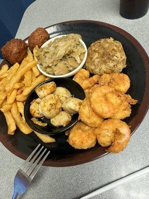 Scallops , shrimp , French fries , crab cake ( salty ) cabbage & hush puppies