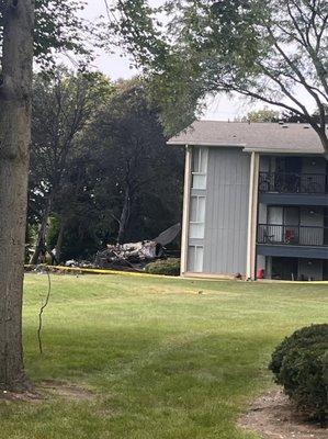 Where the plane landed after hitting a tree. Without hitting the tree the plane would've gone into the building and killed everyone inside.