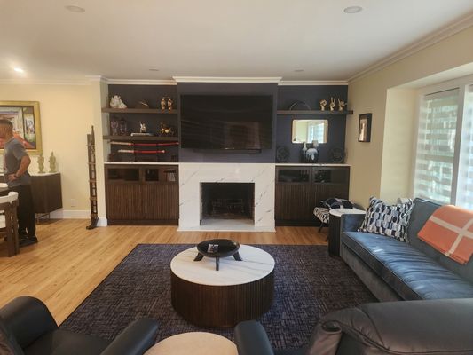 Livingroom,custom fireplace,floating shelves and built in cabinets