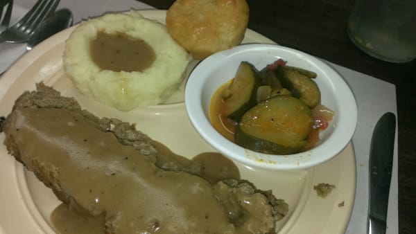 Meatloaf lunch special with mashed potatoes and stewed zucchini $6.44.