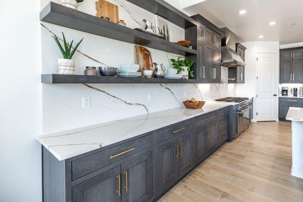 Shelves to match cabinets hold your treasures and deco items.  Add a little green!