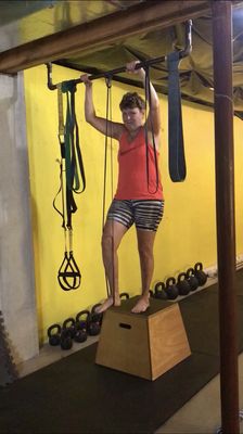 She started doing pull-ups with the biggest band,continually reducing the size as she got stronger, down to the thinnest one.