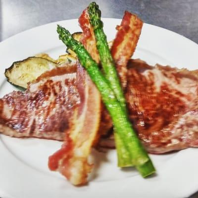 Shell steak apple smoked bacon sauteed aspergus