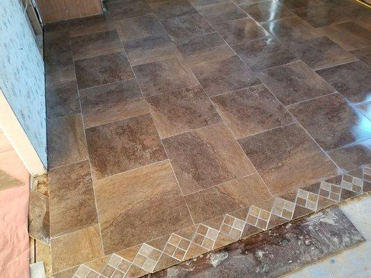 Ceramic flooring installation with custom border