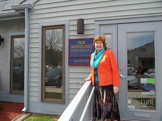 Owner/Audiologist Elizabeth Patterson stading outside the Voorhees Office.