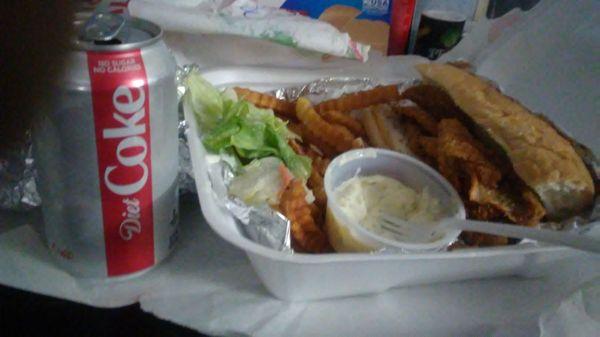 Delicious perch sandwich with fries, tartar sauce and a Coke.