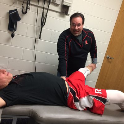 Dr. Haley does soft tissue therapy on a lacrosse athlete.