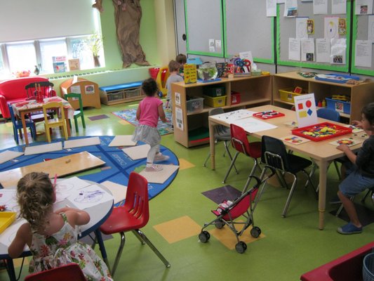 Our preschoolers enjoying exploration and discovery in several of the classroom's learning centers.