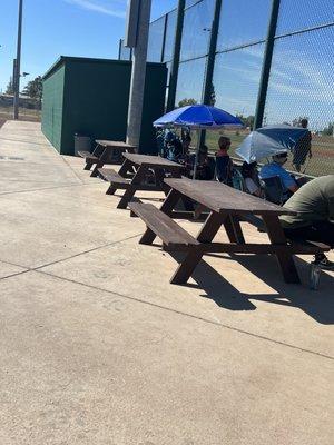 Picnic tables by the dugout