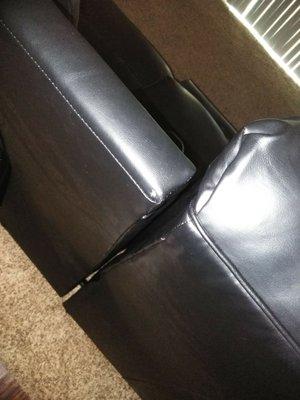 My love seat has a staple or a pin sticking out of it. The recliners are bent also.