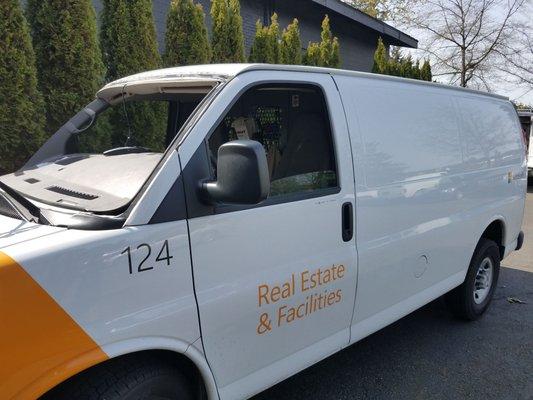 Windshield installation on a Microsoft van.